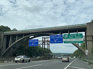 Sign welcoming drivers to the New Jersey Turnpike under the Edgewood Road Bridge in Leonia, New Jersey
