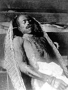 The body of Leander Shaw after the lynching