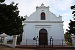 The lovely old Rhenish Mission Church with its fine gables, built in the form of an incomplete T, faces the southern side of the Braak. This is one of the oldest mission churches in South Africa. The delicate architectural treatment which betrays strong Renaissance influence, is typical of early 19th-century architecture. The gable, which bears the date of its erection, 1823, is one of the finest of its kind. In 1840 the northern wing was built.