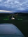Dusk approach into runway 3 at Minute Man Airfield in a Cessna 172 with the runway lights visible