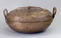 a copper pot inscribed with hebrew letters and floral scrollwork