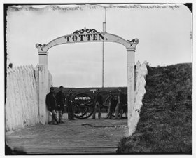 Men and gun of 3d Massachusetts Heavy Artillery at the Fort Totten ornamental gate in 1865