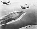 United States bombers fly over Param Island in Chuuk Lagoon during Operation Hailstone.