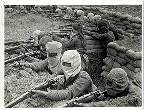 Indian infantry with gas masks in trenches near Fauquissart