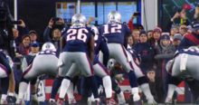 Brady receiving a snap, pictured from behind