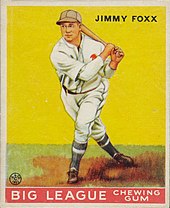 Baseball card depiction of a man in baseball uniform with a bat on his shoulder