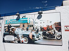 Photo mural of 1963 JFK Motorcade on El Cajon Boulevard with Rudford's in Background. The mural is on the west side of Rudford's restaurant as of 2023.