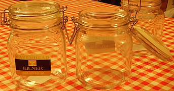 Preserving jar with bail closure, opened and closed