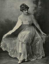 Black and white photo of a young woman in a gown.