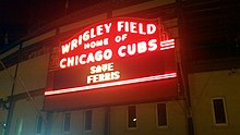 Wrigley Field at night lit up to say 'Save Ferris'