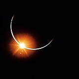 Earth's atmosphere backlit by the Sun in an eclipse observed from deep space onboard Apollo 12 in 1969