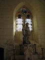 Stained glass and statue in the Church