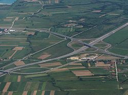 An aerial view of motorway cloverleaf interchage