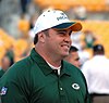 Photo of McCarthy from the side wearing a Packers polo and hat