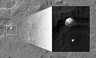 The Curiosity rover during atmospheric entry as seen by HiRISE on August 6, 2012. Supersonic parachute and backshell visible.