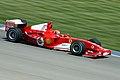 Schumacher at the 2004 United States Grand Prix driving the Scuderia Ferrari F2004 with completely white spaced Marlboro