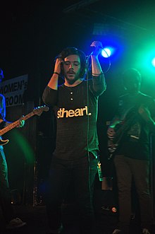 Travis performing with Dance Gavin Dance in 2010