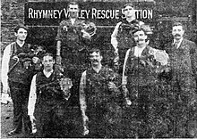 Seven rescuers pose in front of the Rhymney Rescue Station.