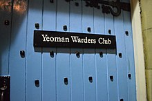 Blue door with text reading "Yeoman Waders Club"