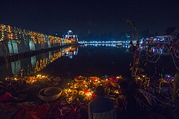 Rani Pokhari, a 17th-century pond in Kathmandu decorated with lights at night for Chhath celebration