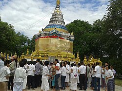 Local people gathering at Wat Phra Thart Chom Chaeng to make merit