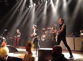 Green Day performing in Cleveland, Ohio in 2015. From left to right: Jason White, Billie Joe Armstrong, Tré Cool and Mike Dirnt.