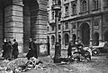 Starving citizens taking meat from the remains of dead horses on Nowy Świat Street near the intersection with Staszic Palace