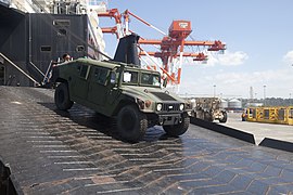 A humvee unloads from the ship during Exercise Freedom Banner 2013