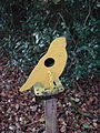 A crow-shaped, knock-over metal air gun field target. The black painted metal paddle must be hit to make the target fall over, and the target can be reset by pulling the orange cord attached to the face-plate.