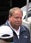 Photo of Holmgren from the shoulders up wearing a Seahawks jacket