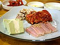 Samhap (lit.three combination) consists of cooked pork, kimchi, and hongeohoe (fermented raw Raja Kenojei)