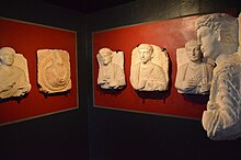 Sculpted headstones in a museum