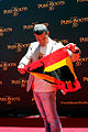 Antonio Banderas, at the Puss in Boots premiere in Sydney on November 27, 2011, holds up a Spanish flag with the Osborne bull