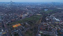 Burgess Park from above. January 2023. Visible tennis court, bmx race track, lake, football fields and other areas of the Bugess Park.