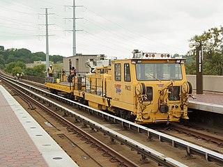 A Washington Metro work car in Virginia providing support for a track maintenance operation