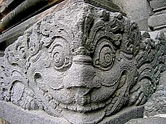 Corner antefix carved as a Kala head