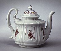 Teapot with relief and painted decoration