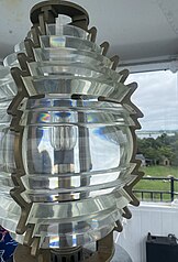 Detail of the Rose Island Light Fresnel lens, a glass composite lens divided into angular sections.