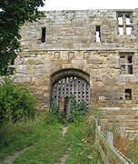 East entrance to the gatehouse, displaying the shields of the Darcys, Meynells and Grays.