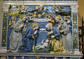 This terracotta relief by Giovanni della Robbia shows the Christ Child as part of the Holy Trinity, adored by Mary, Joseph and Franciscan saints.