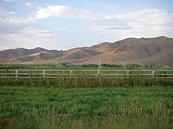 Hills, mountains, and irrigated fields of Picabo