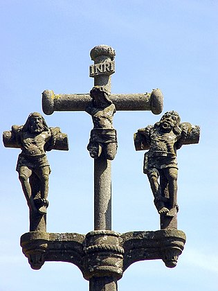 The figure of Christ and the good and bad robbers. Part of the Chapelle Notre-Dame-de-Lorette Calvary at Irvillac