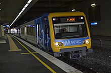 A train departing from an underground station