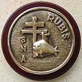 The tampion of the Rubis features the Cross of Lorraine in honour of the Free French submarine Rubis.