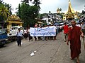Image 33Protesters in Yangon with a banner that reads non-violence: national movement in Burmese, in the background is Shwedagon Pagoda. (from History of Myanmar)