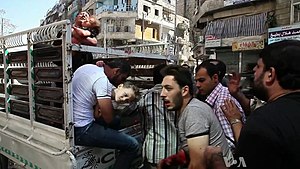 Wounded civilians arrive at hospital Aleppo.jpg