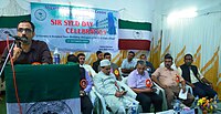 Dr. Umer Thasneem speaking on Sir Syed Day at AMU Malappuram Campus in 2019.