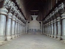 Elaborate prayer hall with pillars in a cave