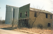 Abandoned store building and grain silos, 1995.