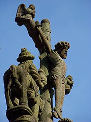 Jesus on the cross and one of the two horsemen on the upper crosspiece